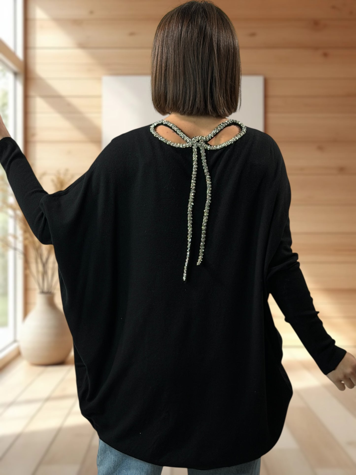 ANAIS - PULL NOIR NOEUD EN STRASS DANS LE DOS JUSQU'A LA TAILLE 52/54